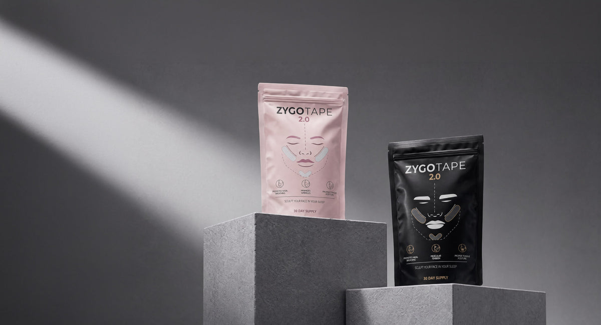 Zygo Tape pink and black 30 day supply pouches on grey plinths